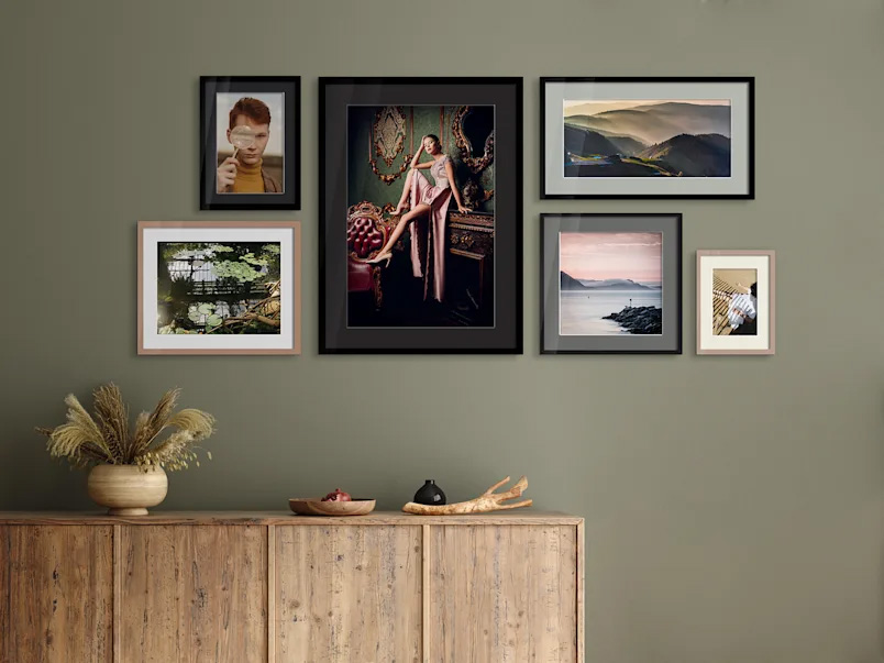 Gallery wall with framed portraits
